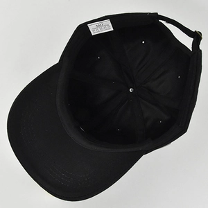 Detail view of the 100% cotton baseball cap interior showing six-panel stitch design