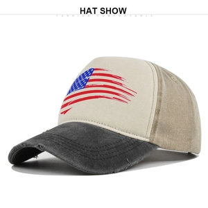 Detailed view of the distressed brim and vintage US flag print on this baseball cap