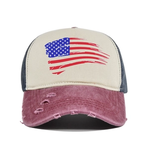 Detailed close-up of distressed brim and American flag print on vintage baseball cap