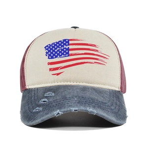 Macro detail of vintage American flag baseball cap with distressed brim and tricolor texture