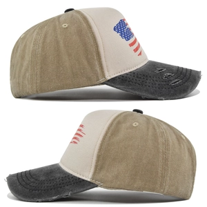 Detailed side view of vintage American flag baseball cap with distressed torn brim edges