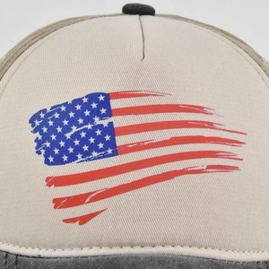 Close-up of vintage distressed American flag print on a washed cotton baseball cap