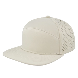Detail of laser-cut ventilation holes on a beige six-panel flat brim hip-hop cap