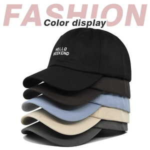 Vertical stack of five embroidered cotton baseball caps in black, brown, blue, and beige
