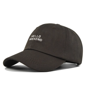 Detailed embroidery of white HELLO WEEKEND text on a dark brown cotton baseball cap