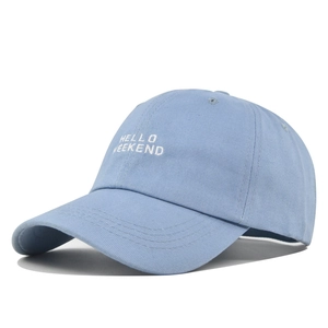 Light blue cotton baseball cap featuring white HELLO WEEKEND embroidery on the front