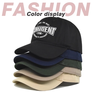 Close-up of cotton baseball caps in multiple colors with white letter embroidery details