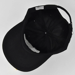 Detailed interior view of black baseball cap showing cotton stitching and sweatband