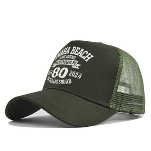 Detail of olive green trucker hat with breathable mesh and D-Day 80th anniversary print