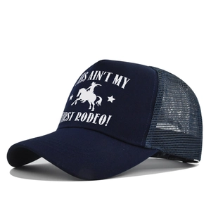 Detail of navy blue trucker hat featuring breathable mesh and white rodeo graphic print