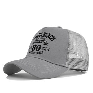 Close-up of Omaha Beach 80th anniversary print on grey mesh trucker cap with stitching