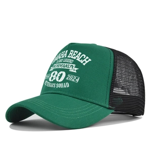 Detail view of the Omaha Beach D-Day printing on a green and black mesh trucker cap