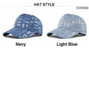 Detail of vintage washed denim caps in navy and light blue with laser QUEEN print