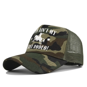 Detail of camouflage trucker hat featuring rodeo graphic and breathable mesh back