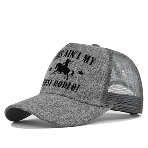 Detail of grey mesh trucker hat featuring vintage rodeo print and breathable fabric