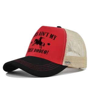 Detail of red and beige trucker hat with vintage rodeo print and breathable mesh