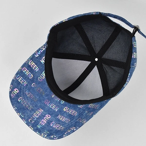 Detail view of the interior construction and adjustable strap on the QUEEN denim baseball cap