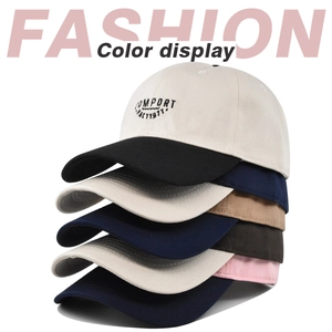 Detailed stack of cotton baseball caps showing embroidered COMFORT FACT 1977 text