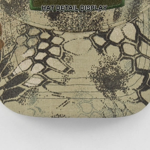 Detail of tactical baseball cap showing camouflage ripstop fabric and reinforced brim sewing