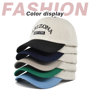 Close-up detail of five Arizona embroidered baseball caps in assorted brim colors