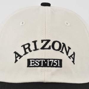 Detail of ARIZONA 3D embroidery on a two-tone cotton baseball cap with twill texture