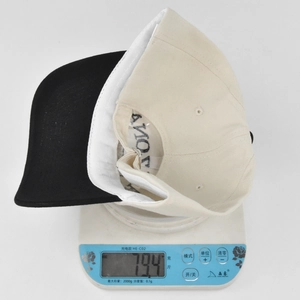 Detailed view of ARIZONA baseball cap on a digital scale weighing 79.4g for quality check
