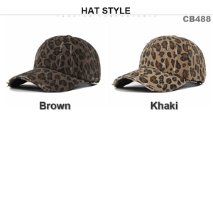 Detail view of distressed leopard print baseball caps showing frayed brim and vintage texture