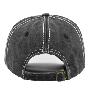 Detail of adjustable vintage brass buckle and white contrast stitching on grey baseball cap