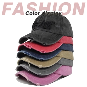 Detail of vintage washed cotton baseball caps with 3D NEW YORK embroidery and distressed edges