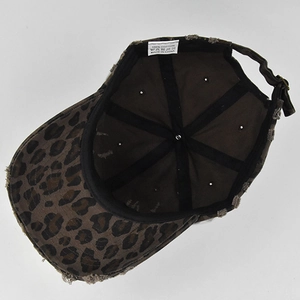 Detail view of cotton leopard print baseball cap with interior lining and metal buckle