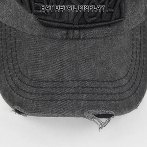 Detail of vintage washed denim baseball cap with New York 3D embroidery and distressed edges