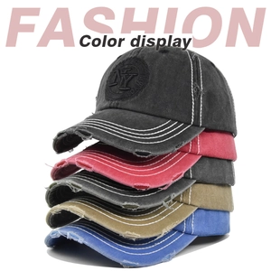 Detailed stack of vintage washed baseball caps with NY embroidery and distressed edges