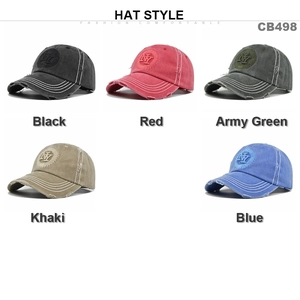 Detail of distressed baseball caps showing NY embroidery and worn edge brim effects