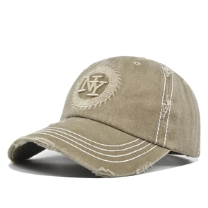 Close-up of distressed vintage NY baseball cap with frayed edges and thick white stitching