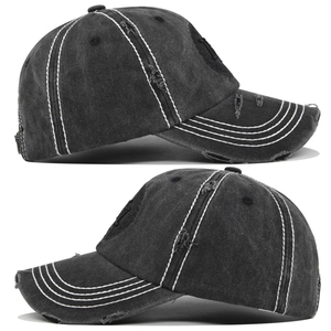 Close-up of distressed denim baseball cap featuring vintage NY embroidery and frayed brim