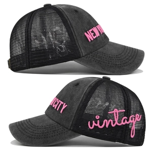 Detail of vintage New York 3D embroidery and washed denim mesh on a baseball cap