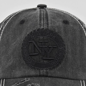 Vintage dark gray washed denim baseball cap with NY embroidery and distressed edges