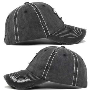Detailed side view of vintage washed grey baseball cap with distressed embroidery and Lucky numbers