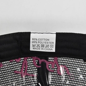 Detail shot of vintage baseball cap interior showing 80% cotton label and mesh stitching