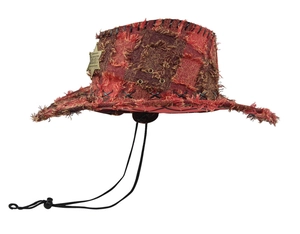 Close-up of vintage sheriff cowboy hat with star badge and distressed patch details