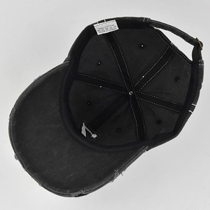 Internal view of dark grey cotton baseball cap with reinforced seams and metal buckle