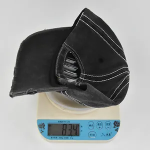 Detailed shot showing the 83.4g lightweight vintage washed cotton baseball cap on a scale