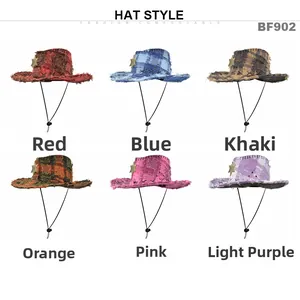 Detail of distressed cowboy hats with fringe edges and star badges in six vibrant colors