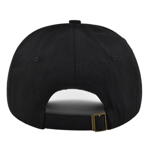 Detail of black baseball cap showing the adjustable cotton strap and bronze metal buckle