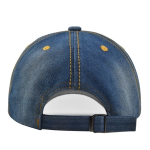 Detail of blue denim baseball cap showing metal adjustable buckle and yellow stitching