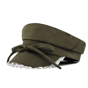 Detail of olive green navy hat featuring white lace trim and a central bow accent