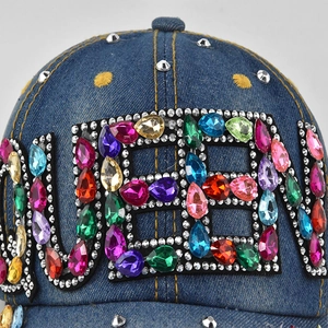 Blue denim baseball cap with QUEEN rhinestone lettering and silver metal rivets detail