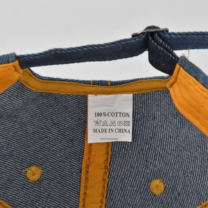 Detailed view of the 100% cotton baseball cap interior with adjustable metal buckle strap