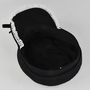 Close-up of Lolita style wool beret with delicate white lace trim and black fabric