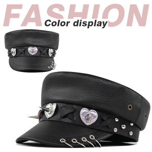 Detail view of black PU leather punk octagonal hat with metal rings and laser heart patches